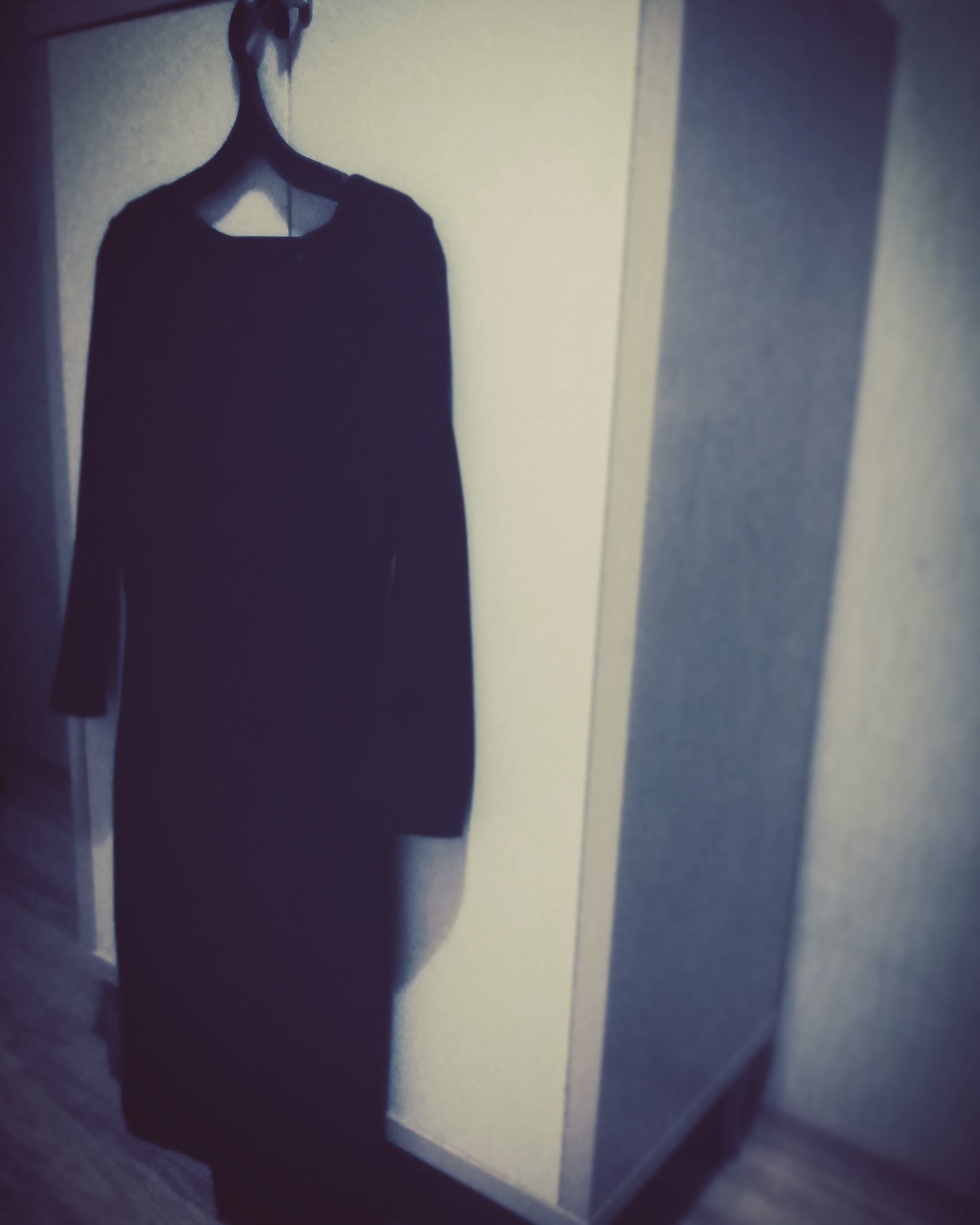 Photo of dress hanging on a wall