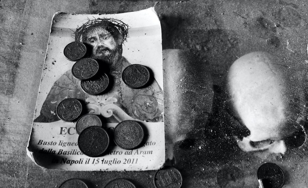 Coins rest atop an image of Jesus