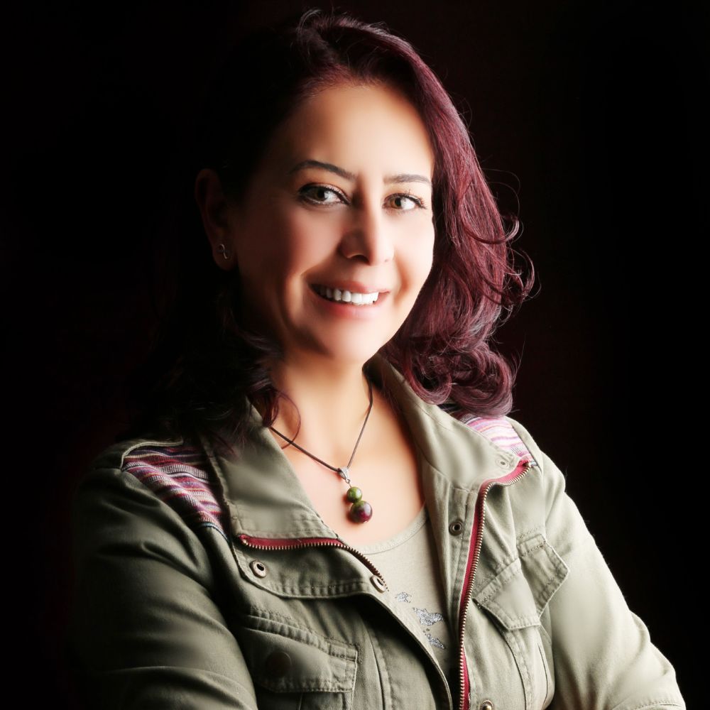 A portrait of Lana al-Majali with a black background.